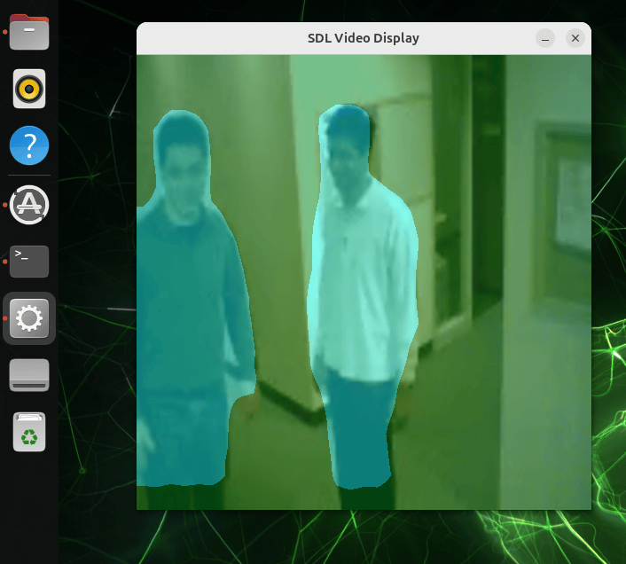 SDL window on the Jetson display showing a traffic video frame with the semantic segmentation overlay, where each road, vehicle, and background region is tinted with the color assigned to its class.