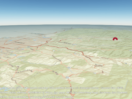 Red circular point plotted over terrain