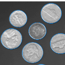 Blue circles overlaid on a grayscale image of coins